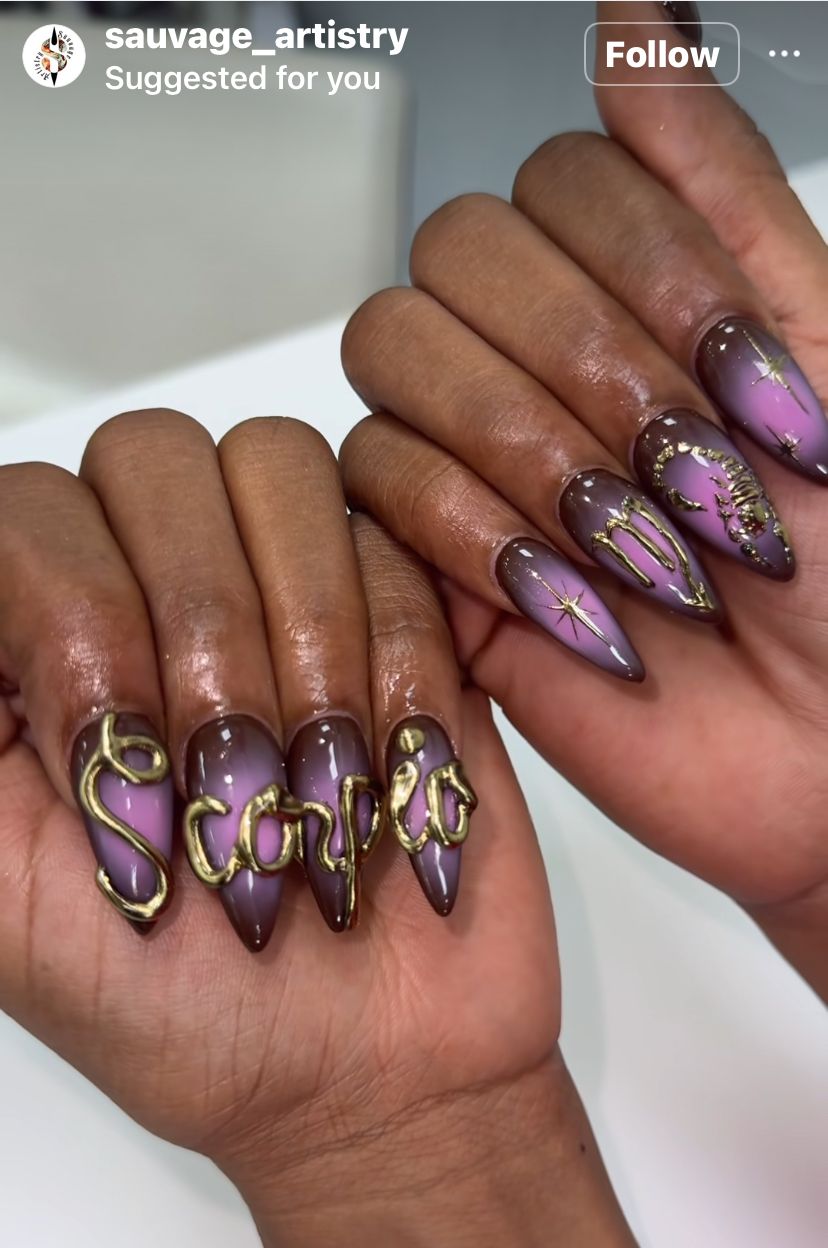 Close-up of manicured hands with dark brown to light purple ombré nails.