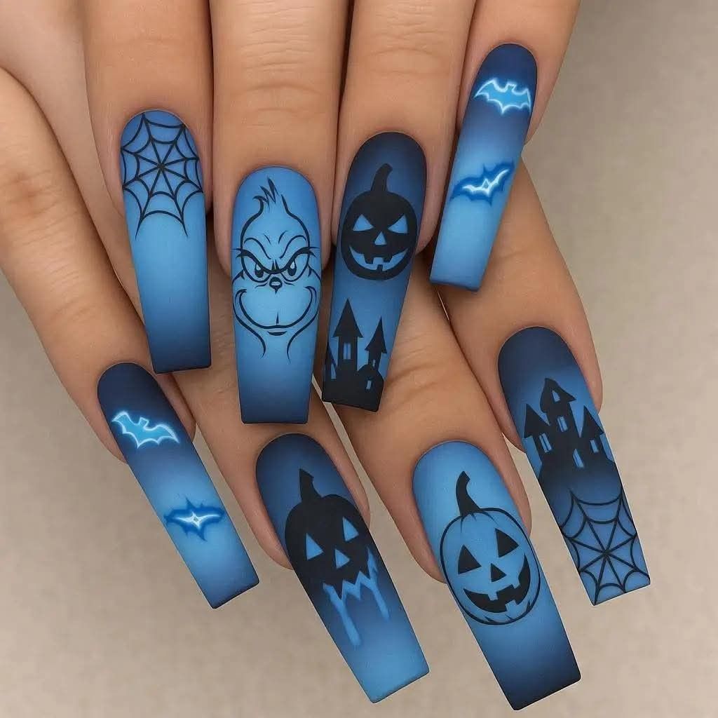 Long blue gradient coffin-shaped nails with black Halloween designs including spiderwebs, pumpkins, haunted houses, bats…